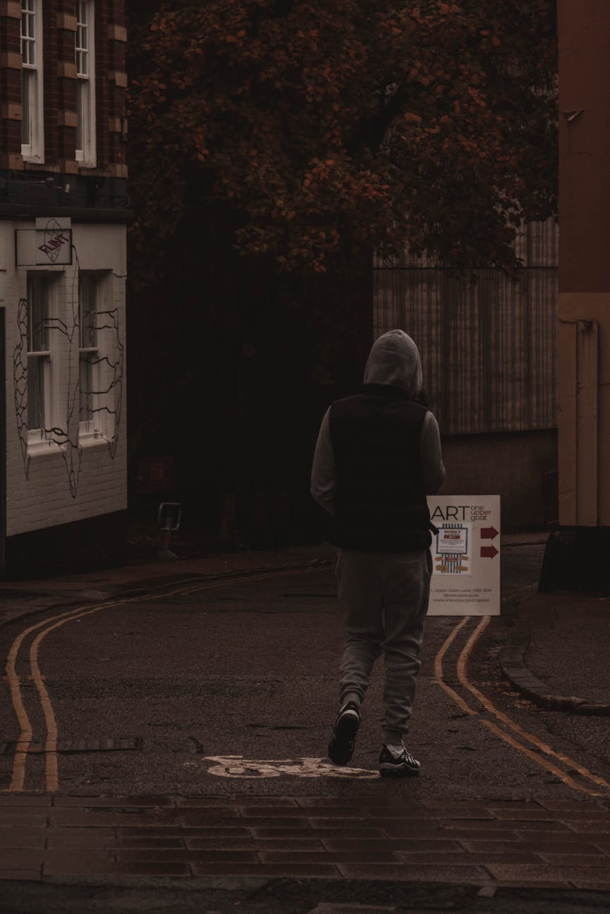 man walking on bike path